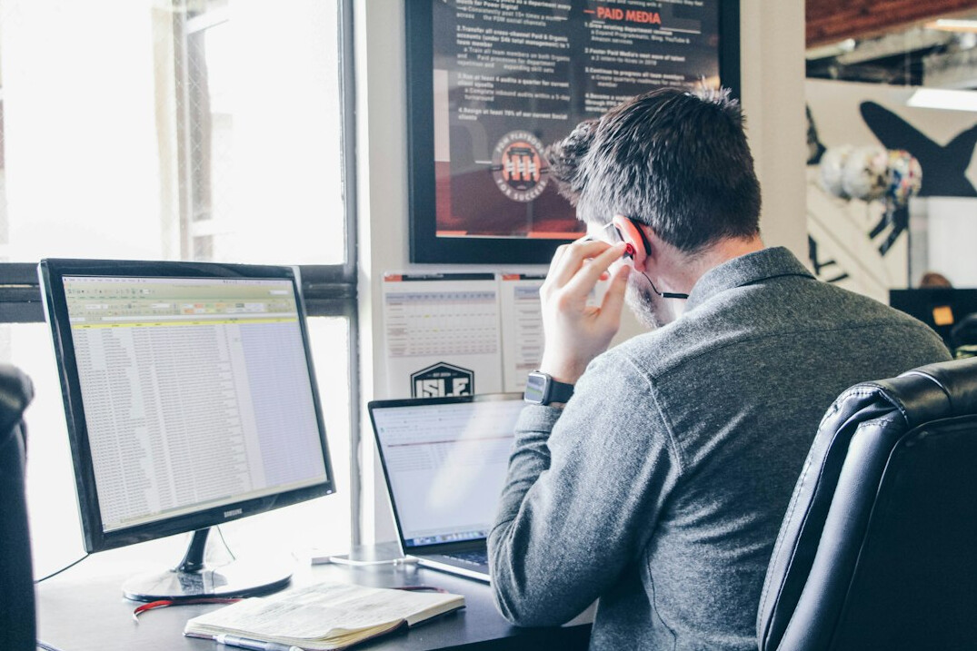 programmer coding at desk