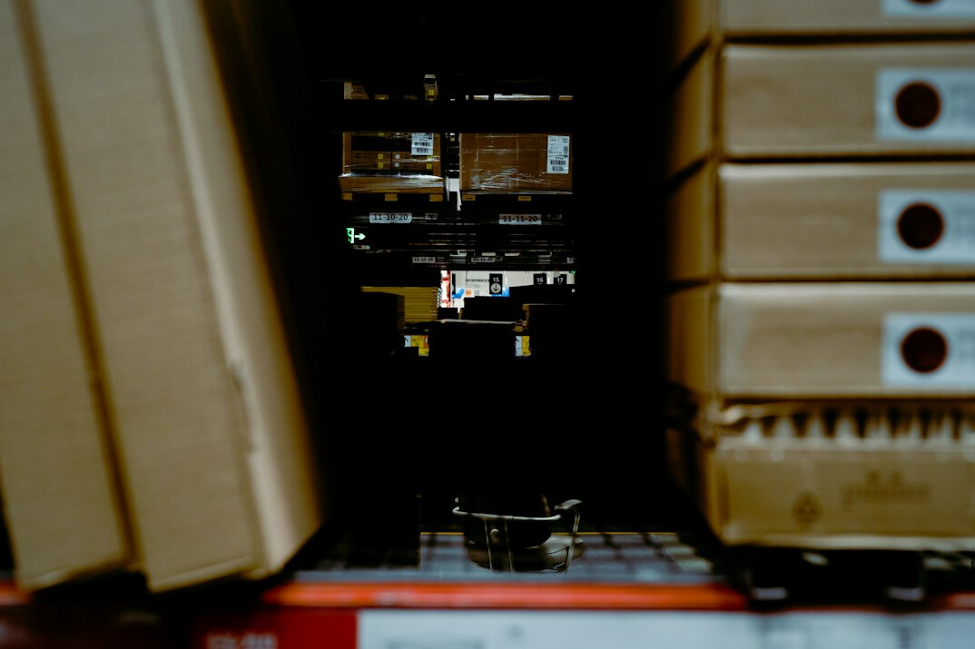 Two computer monitors showing a software architecture diagram with connected boxes