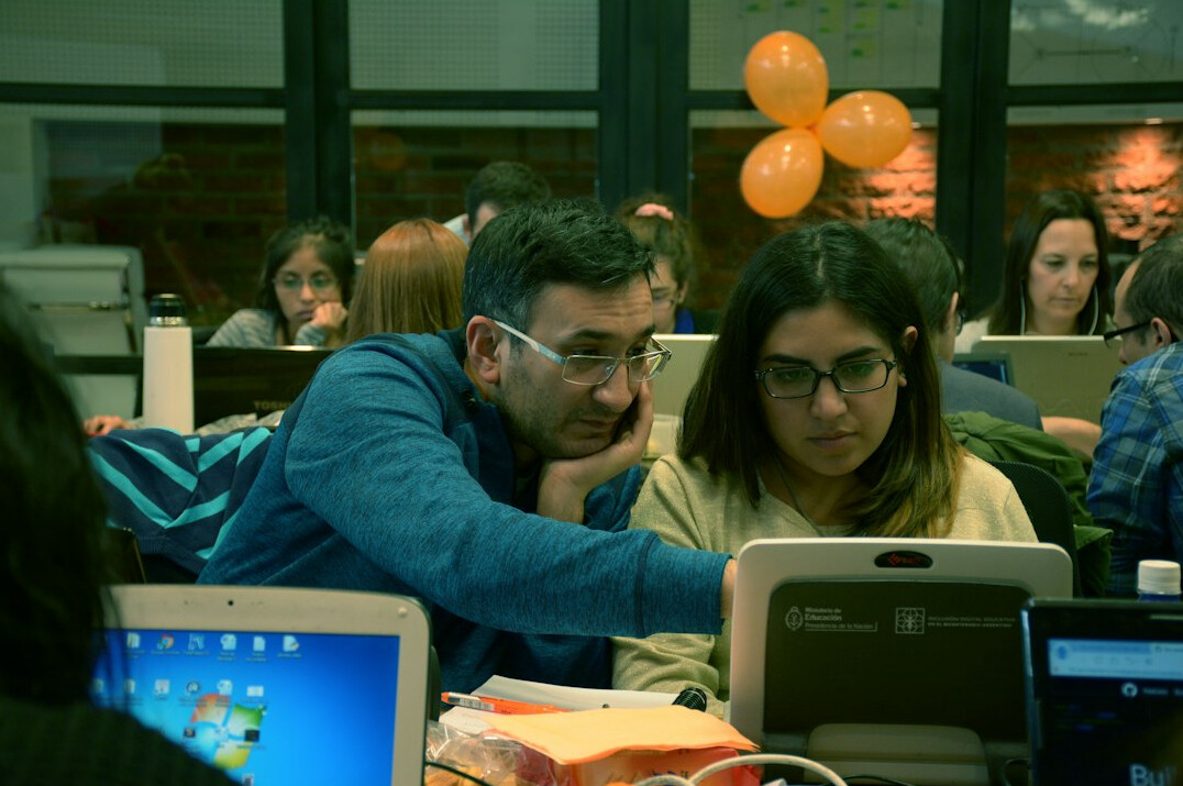 students coding together